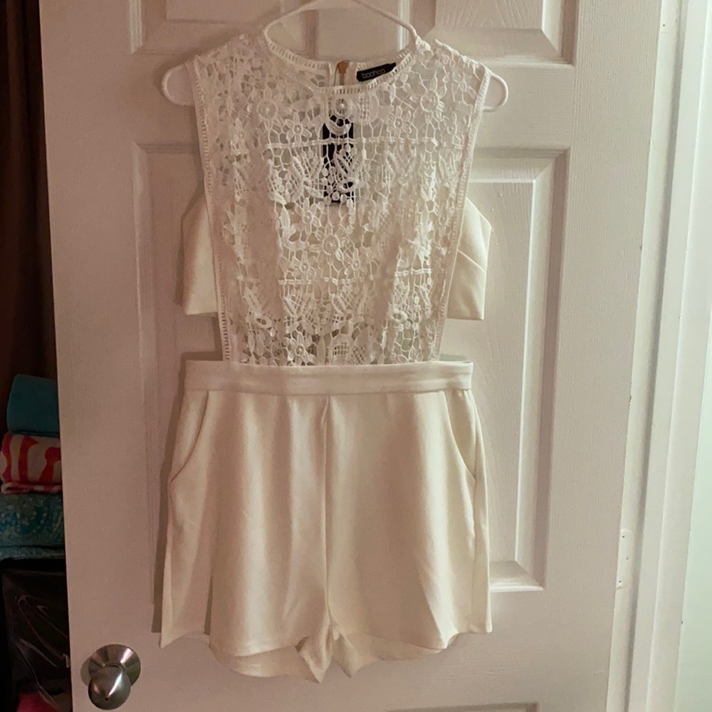 White romper with cutout and lace detail